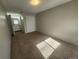 Bedroom featuring neutral carpet, closet, painted walls, and access to a bathroom at 9650 Huron St # 23, Thornton, CO 80260