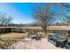 Expansive backyard with a spacious patio, outdoor furniture, and a trampoline, perfect for Gathering enjoyment at 1164 English Sparrow Trl, Highlands Ranch, CO 80129