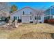 Cozy backyard featuring a patio with outdoor seating, a grill, and well-maintained lawn at 1164 English Sparrow Trl, Highlands Ranch, CO 80129