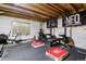 Well-equipped basement gym featuring weightlifting equipment, rowing machine, and rubber flooring for fitness enthusiasts at 1164 English Sparrow Trl, Highlands Ranch, CO 80129