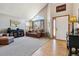 Bright living room featuring vaulted ceilings, hardwood floors, and natural light at 1164 English Sparrow Trl, Highlands Ranch, CO 80129