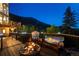 Beautiful view from the back deck with a cozy firepit, perfect for enjoying the starry night at 1194 Snyder Mountain Rd, Evergreen, CO 80439