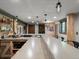 Modern bar area boasts a concrete countertop, wooden accents, and stylish pendant lighting at 1194 Snyder Mountain Rd, Evergreen, CO 80439
