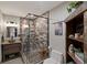 Stylish bathroom featuring a walk-in shower, rustic vanity, and tasteful decor at 1194 Snyder Mountain Rd, Evergreen, CO 80439