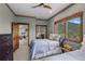 Comfortable bedroom featuring scenic wallpaper trim and a view of the mountains at 1194 Snyder Mountain Rd, Evergreen, CO 80439