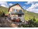 A beautiful exterior shot showcasing the home's architecture and landscaping at 1194 Snyder Mountain Rd, Evergreen, CO 80439