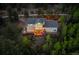 Exterior aerial view of home featuring a deck, hot tub, and scenic woodland setting at 1194 Snyder Mountain Rd, Evergreen, CO 80439