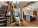 Spacious living room with high ceilings, large windows, rock feature, and open access to kitchen at 1194 Snyder Mountain Rd, Evergreen, CO 80439