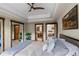 Spacious main bedroom with tray ceiling and a doorway to an en suite bathroom at 1194 Snyder Mountain Rd, Evergreen, CO 80439