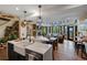 Bright and airy open-concept design seamlessly connects kitchen, dining, and living areas at 1194 Snyder Mountain Rd, Evergreen, CO 80439