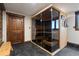 Home sauna featuring a wood door and a glass front at 1194 Snyder Mountain Rd, Evergreen, CO 80439