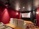 Home theater room with comfortable seating, a projector screen, and ambient lighting at 1194 Snyder Mountain Rd, Evergreen, CO 80439