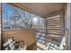 Private balcony with two chairs and a view of the trees at 6700 W 11Th Ave # 205, Lakewood, CO 80214