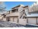 Tan multi-unit building with attached garages and stairs at 6700 W 11Th Ave # 205, Lakewood, CO 80214