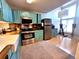 Spacious kitchen featuring blue cabinets, wood countertops, stainless steel appliances and lofted ceilings at 6700 W 11Th Ave # 205, Lakewood, CO 80214