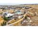 Aerial view of community featuring pool, community center, playground, and many single-Gathering homes at 14193 Double Dutch Cir, Parker, CO 80134