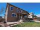 Spacious backyard featuring a covered patio and well-maintained lawn, perfect for outdoor entertaining at 14193 Double Dutch Cir, Parker, CO 80134