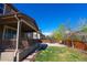 Wide backyard view of the home featuring a large patio, fenced yard, and a trampoline at 14193 Double Dutch Cir, Parker, CO 80134