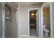 Tiled shower leads to walk-in closet and separate toilet area in this neutral primary bathroom at 14193 Double Dutch Cir, Parker, CO 80134