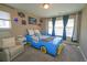 Fun bedroom featuring a playful car bed, soft carpeting, and bright natural light at 14193 Double Dutch Cir, Parker, CO 80134