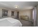 Spacious bedroom features carpet, neutral paint, and gold toned mirrored dresser at 14193 Double Dutch Cir, Parker, CO 80134