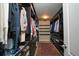Organized walk-in closet featuring custom shelving, drawers and hanging storage at 14193 Double Dutch Cir, Parker, CO 80134