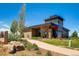Modern community center with stone and wood accents, surrounded by green landscaping at 14193 Double Dutch Cir, Parker, CO 80134