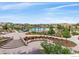 An aerial view of a meticulously landscaped community area with a pool, pathways, and seating at 14193 Double Dutch Cir, Parker, CO 80134