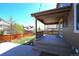 Inviting covered patio with ample space for seating, offering a relaxing outdoor experience at 14193 Double Dutch Cir, Parker, CO 80134