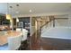 Open-concept kitchen featuring a spacious island with seating and dark wood cabinetry at 14193 Double Dutch Cir, Parker, CO 80134