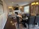 Open-concept living and dining areas with fireplace, hardwood floors, and modern decor at 14193 Double Dutch Cir, Parker, CO 80134