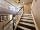 Staircase featuring a white spindle banister, two-tone stairs and hardwood floors at 14193 Double Dutch Cir, Parker, CO 80134