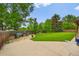 Backyard featuring a grassy area, concrete patio, and patio furniture at 8896 W Prentice Ave, Littleton, CO 80123