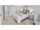 Bright bedroom with neutral tones, a comfortable bed, and ample closet space at 8896 W Prentice Ave, Littleton, CO 80123