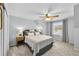 Comfortable bedroom with neutral decor, ceiling fan, and ample natural light at 8896 W Prentice Ave, Littleton, CO 80123