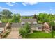 Charming home featuring a well-manicured lawn and inviting two-car garage at 8896 W Prentice Ave, Littleton, CO 80123