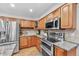 Well-equipped kitchen boasting stainless steel appliances and ample counter space at 8896 W Prentice Ave, Littleton, CO 80123