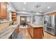 Modern kitchen features granite countertops, wood floors and stainless steel appliances at 8896 W Prentice Ave, Littleton, CO 80123