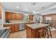Modern kitchen features granite countertops, wood floors, stainless steel appliances and kitchen island with seating at 8896 W Prentice Ave, Littleton, CO 80123