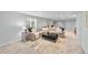 Spacious living room with a comfortable sectional sofa and a large window for natural light at 8896 W Prentice Ave, Littleton, CO 80123