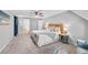 Spacious main bedroom with neutral tones, a ceiling fan, and a king-size bed at 8896 W Prentice Ave, Littleton, CO 80123