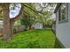 Large backyard features mature trees, a shed, and patio furniture at 2083 W Arbor Ave, Littleton, CO 80120