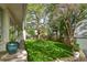 Large grass backyard with mature trees, landscaping, and privacy fence at 2083 W Arbor Ave, Littleton, CO 80120