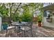 Outdoor patio with a metal table, chairs and gravel landscaping at 2083 W Arbor Ave, Littleton, CO 80120