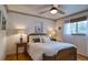 Cozy bedroom featuring a comfortable bed and wood trim at 2083 W Arbor Ave, Littleton, CO 80120