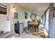 Bright dining area featuring natural light, tile flooring and a dining table with chairs at 2083 W Arbor Ave, Littleton, CO 80120