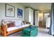 Bright living area featuring natural light, a futon, artistic decor and ample storage at 2083 W Arbor Ave, Littleton, CO 80120