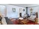 Cozy living area with hardwood floors, comfortable seating, and classic decorative accents at 2083 W Arbor Ave, Littleton, CO 80120