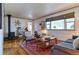 Inviting living room with wood floors, fireplace and cozy furniture, perfect for relaxation at 2083 W Arbor Ave, Littleton, CO 80120