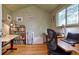 Bright office with hardwood floors, built-in bookshelves, and a large window at 2083 W Arbor Ave, Littleton, CO 80120